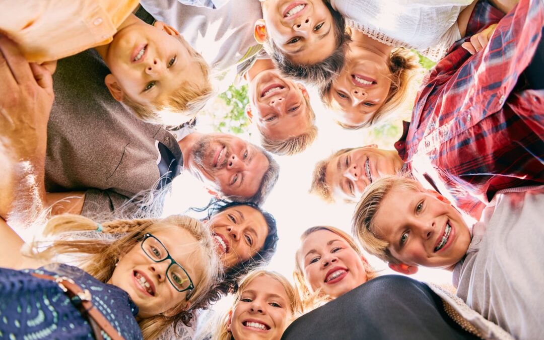 Large happy sibling groups with their foster parents